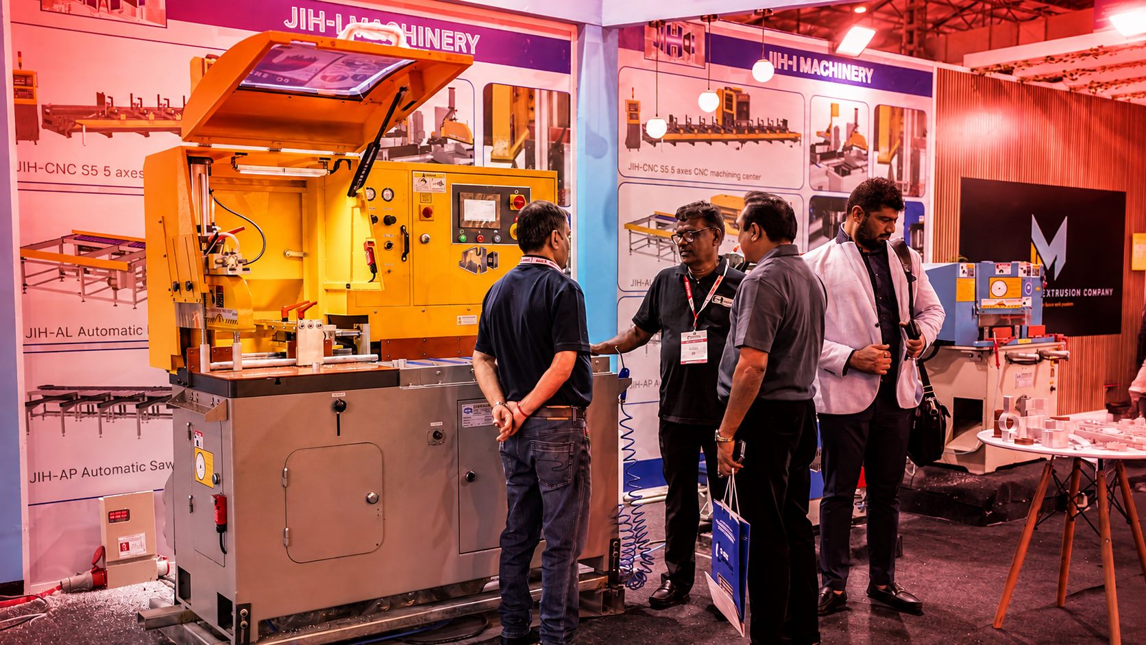 Buyers discussing CNC machining equipment at the expo